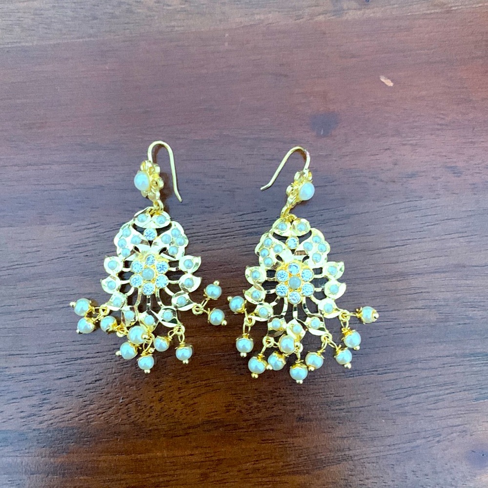 White pearl earrings.
